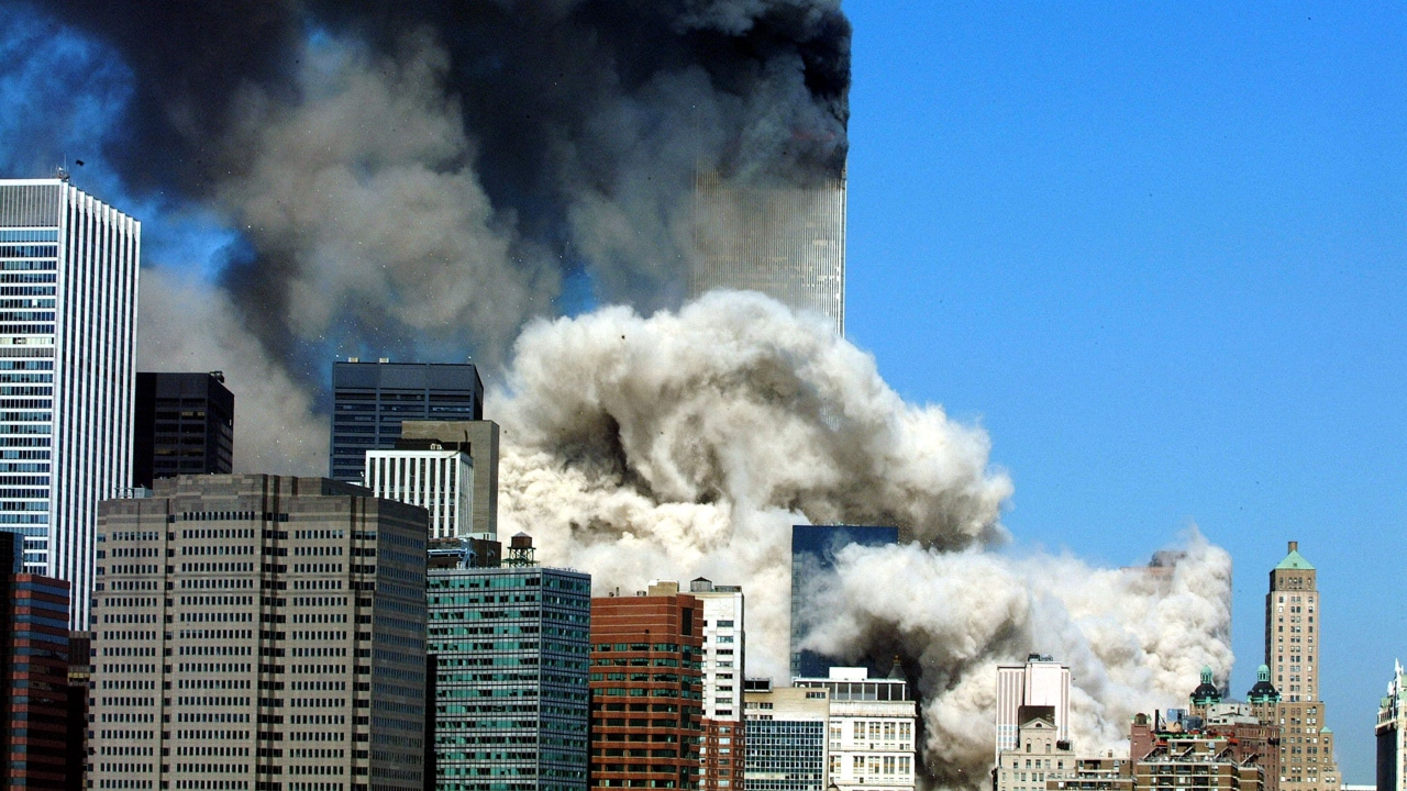 Smoke billows after the first of the two towers of the World Trade Center collapses. Credit: AFP/File Photo