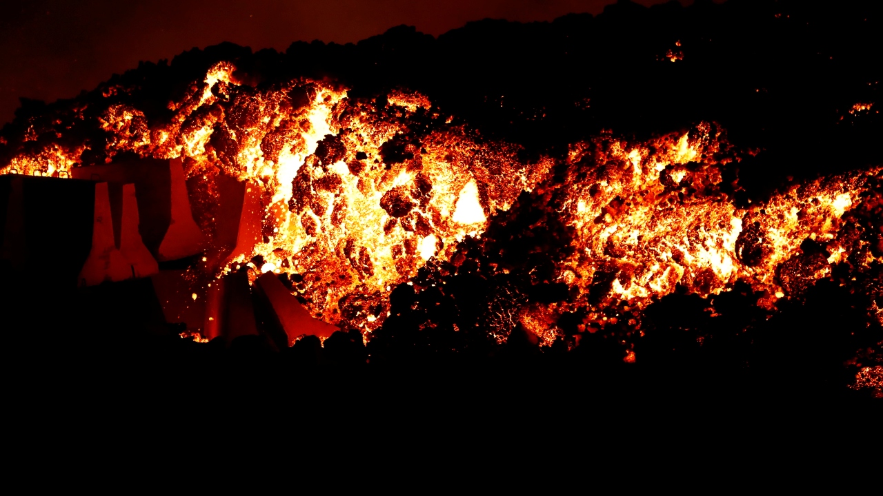 Lava flows downhill following the eruption of a volcano in the Cumbre Vieja national park at El Paso, on the Canary Island of La Palma. Credit: Reuters Photo