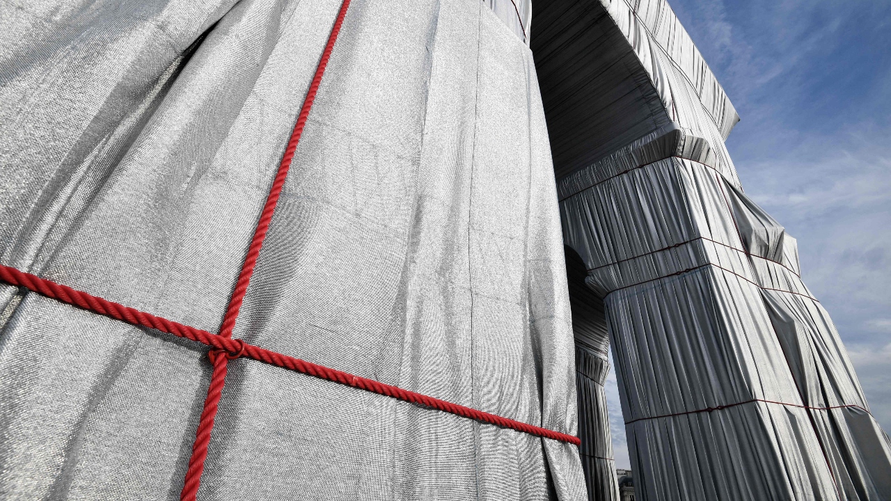 Bulgarian-born Christo Vladimirov Javacheff met Jeanne-Claude Denat de Guillebon in Paris in 1958 and they later became lovers. The idea for the artwork was born in the early '60s, when they lived in Paris. Jeanne-Claude died in 2009, and Christo in May last year. The monument was to be wrapped last fall, but the Covid-19 pandemic delayed it. Credit: AFP Photo