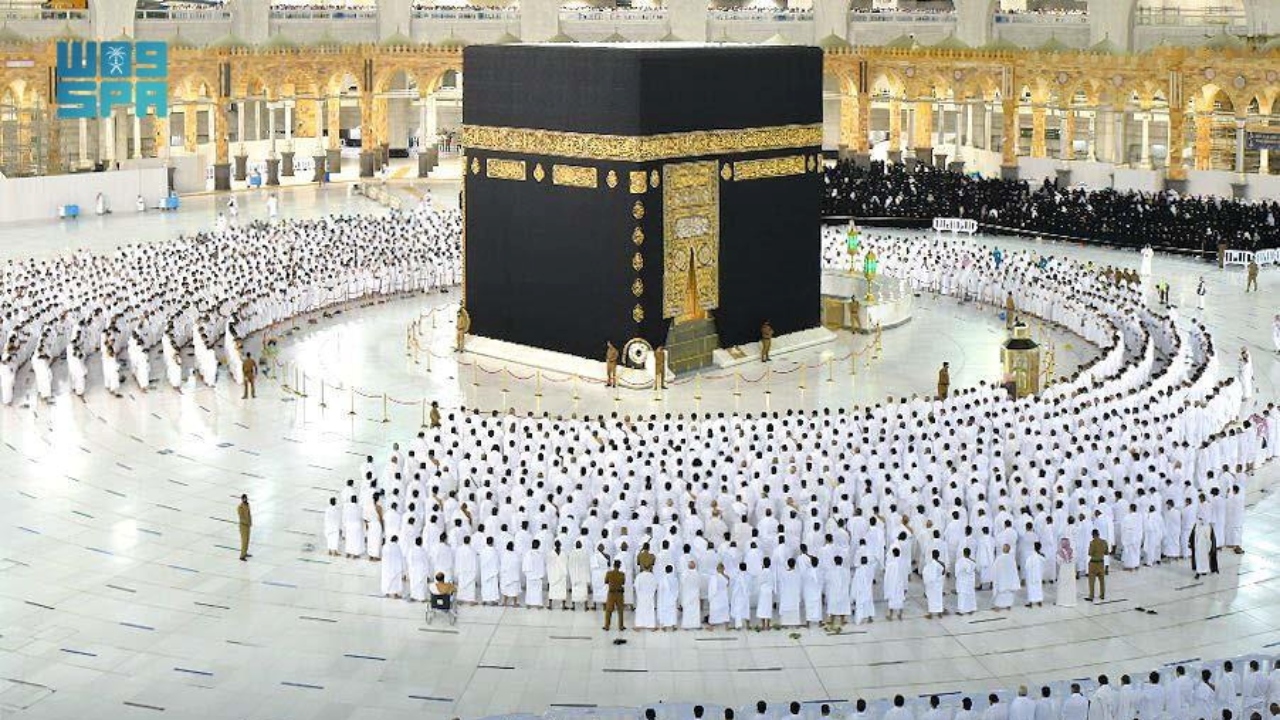 Pilgrims perform the Fajr prayer without social distancing, after Saudi authorities announced the easing of coronavirus disease (Covid-19) restrictions, at the Grand Mosque in holy city of Mecca, Saudi Arabia. Credit: Saudi Press Agency/Handout via Reuters