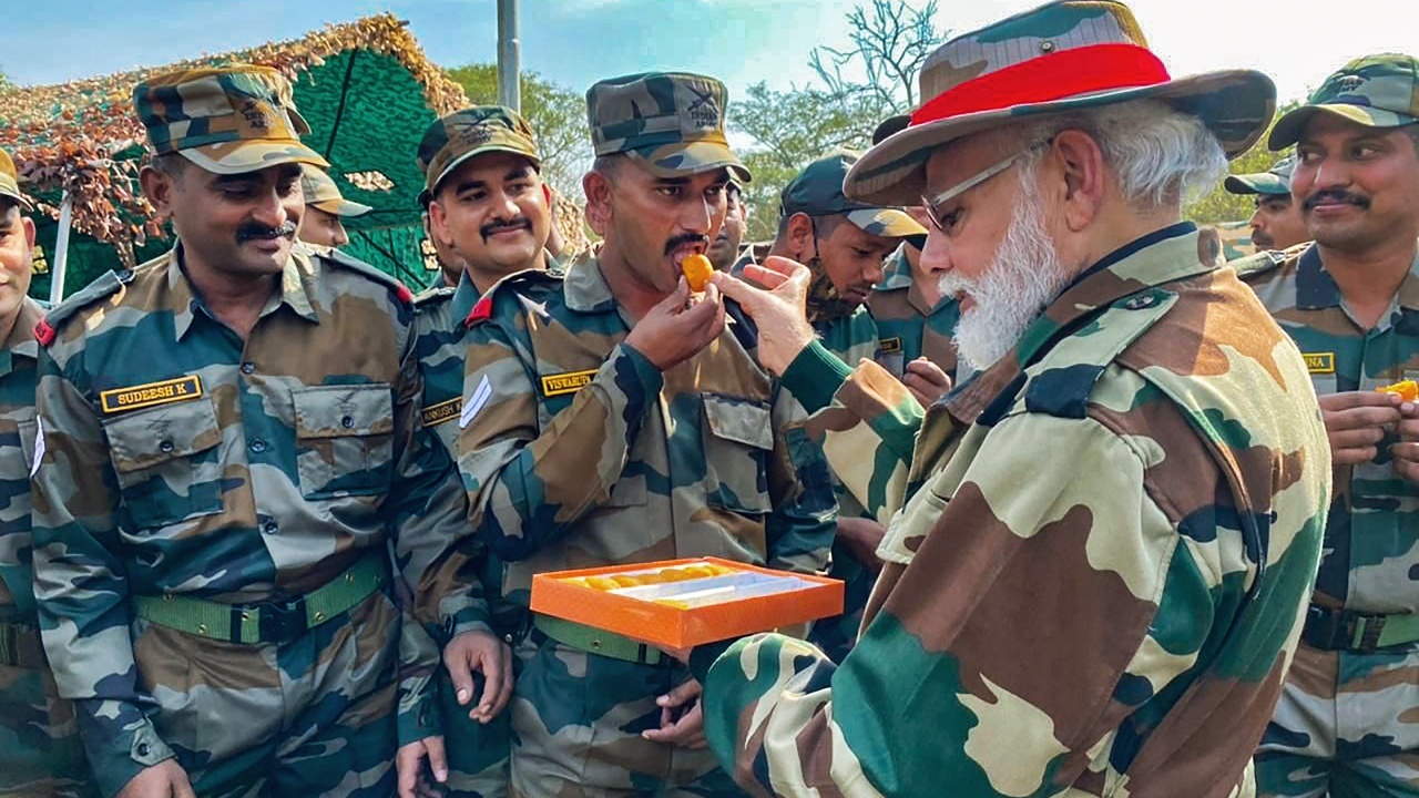 PM Modi feeds sweets to an Army personnel at Rajouri in J&K. Credit: PMO