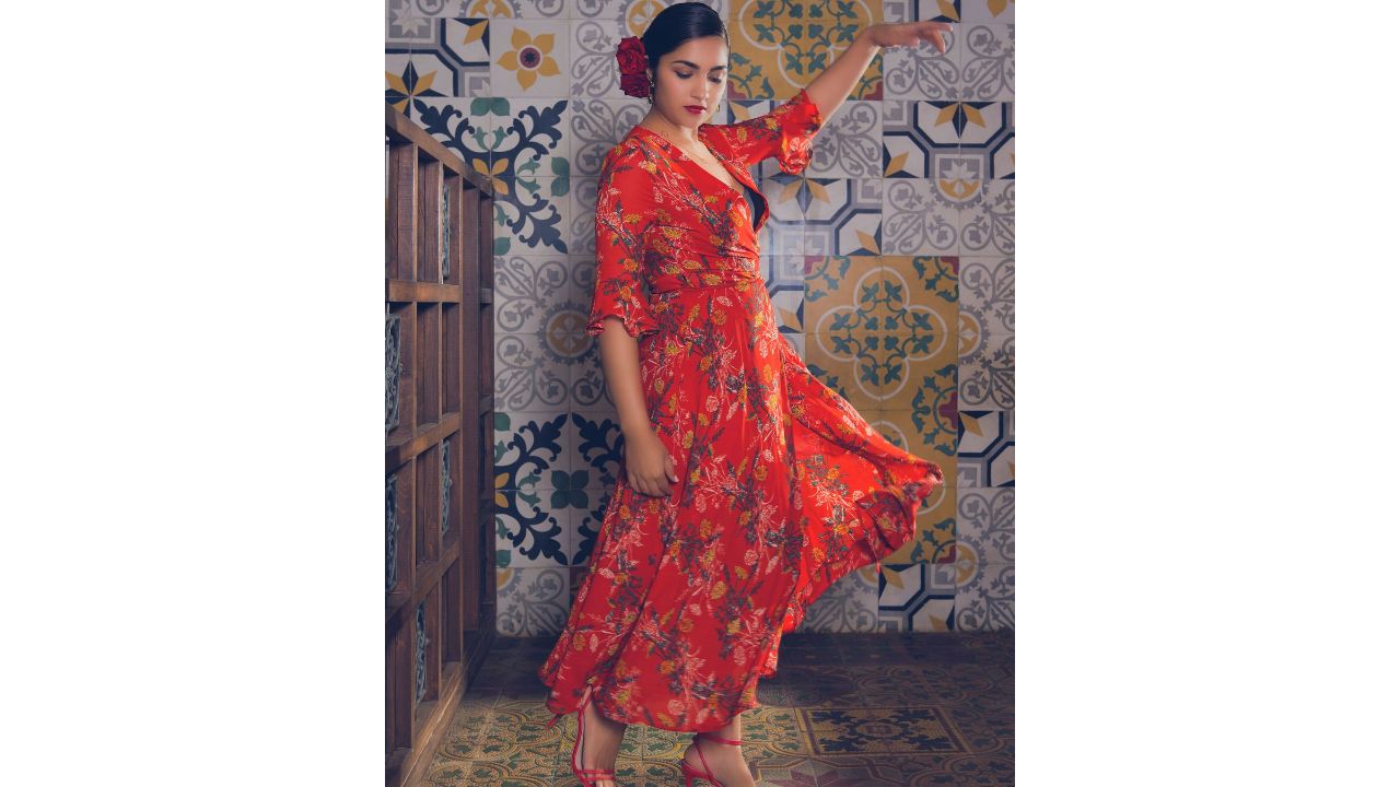 Rukmini works her charm in a floral orange dress. Credit: Instagram/rukmini_vasanth