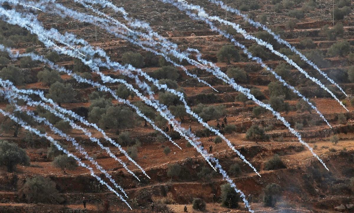 Palestinian protesters and Israeli security forces clash following a demonstration against settlements in the village of Beita in the occupied West Bank. Credit: AFP Photo