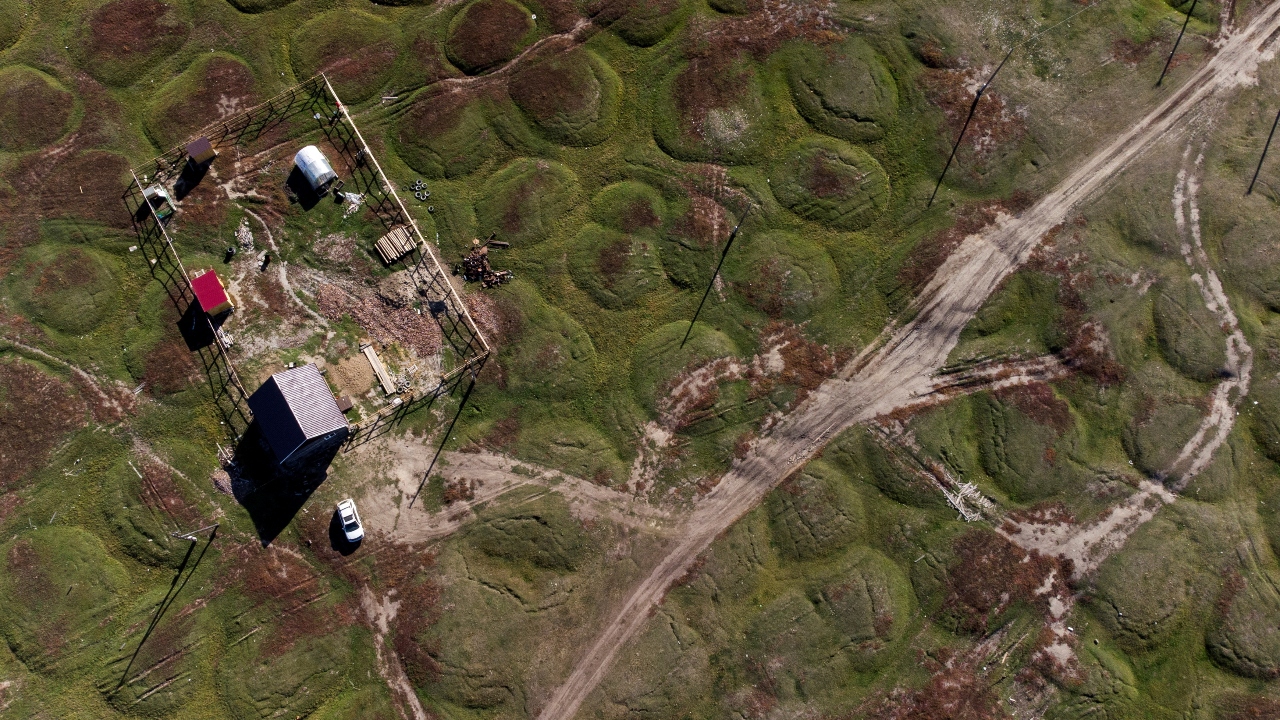 Infrastructure and homes are increasingly in peril in Russia as underground permafrost melts and deforms the land underneath them. Credit: Reuters Photo