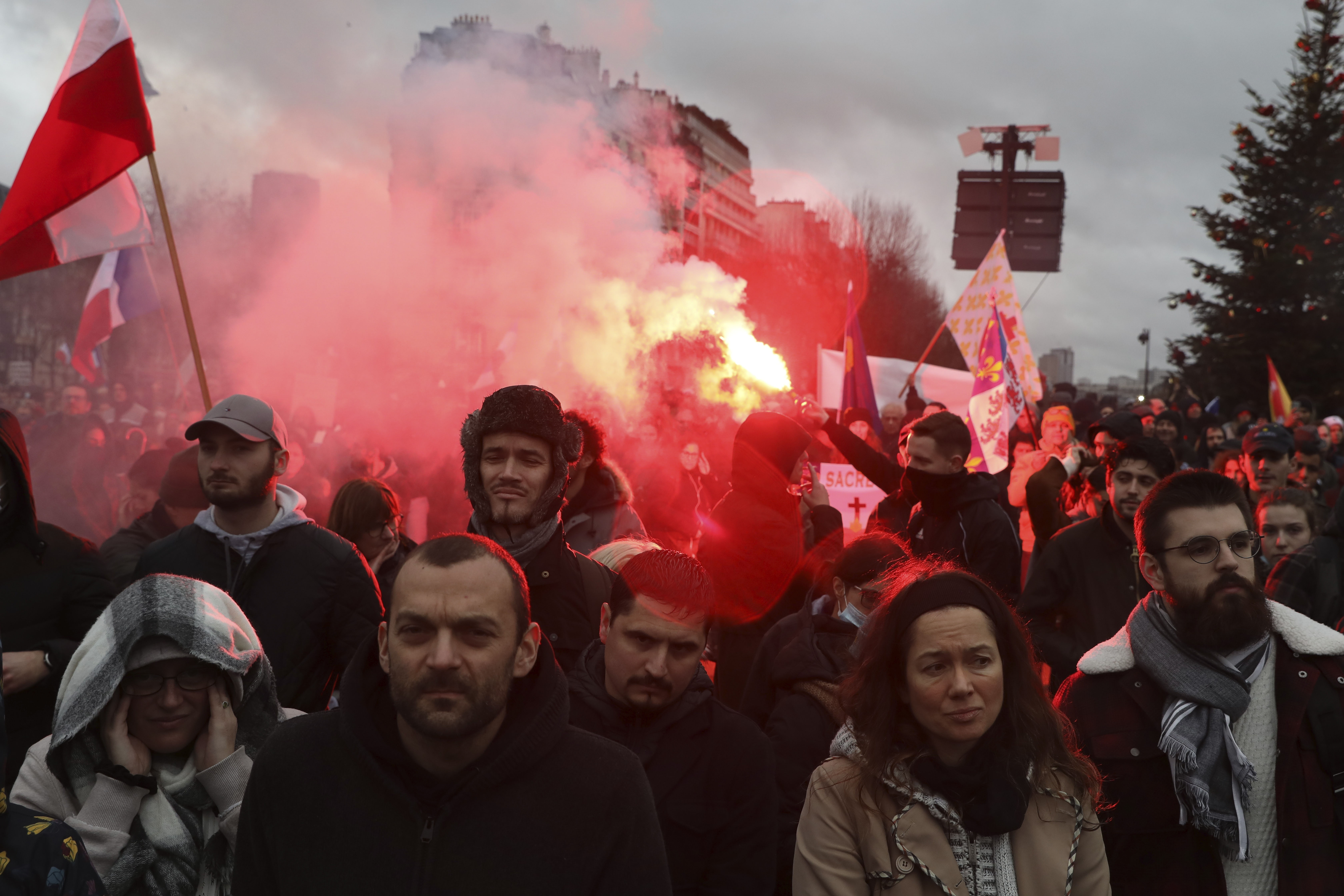 Demonstrators, in opposition to vaccine pass and vaccinations to protect against Covid-19 gather during a rally in Paris, France. Credit: AP Photo