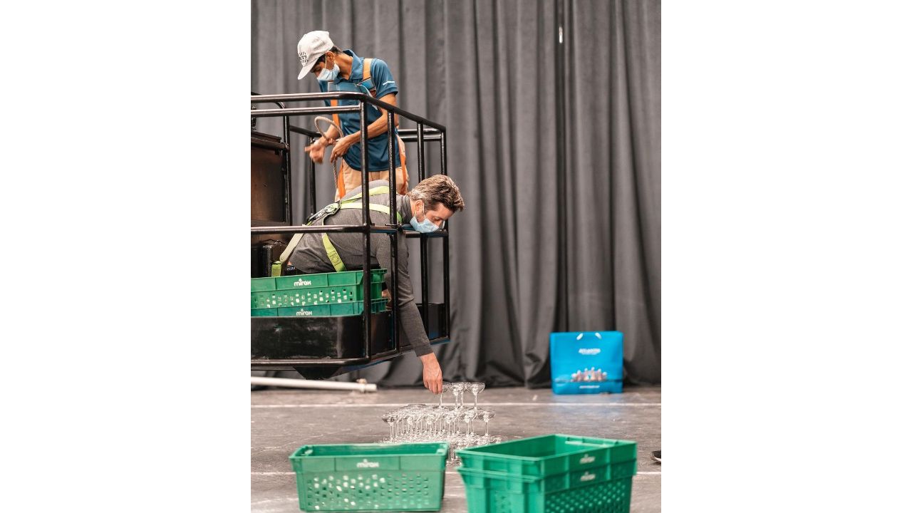 Workers are seen building the champagne tower at hotel Atlantis The Palm in Dubai. Credit: Instagram/maximecasa