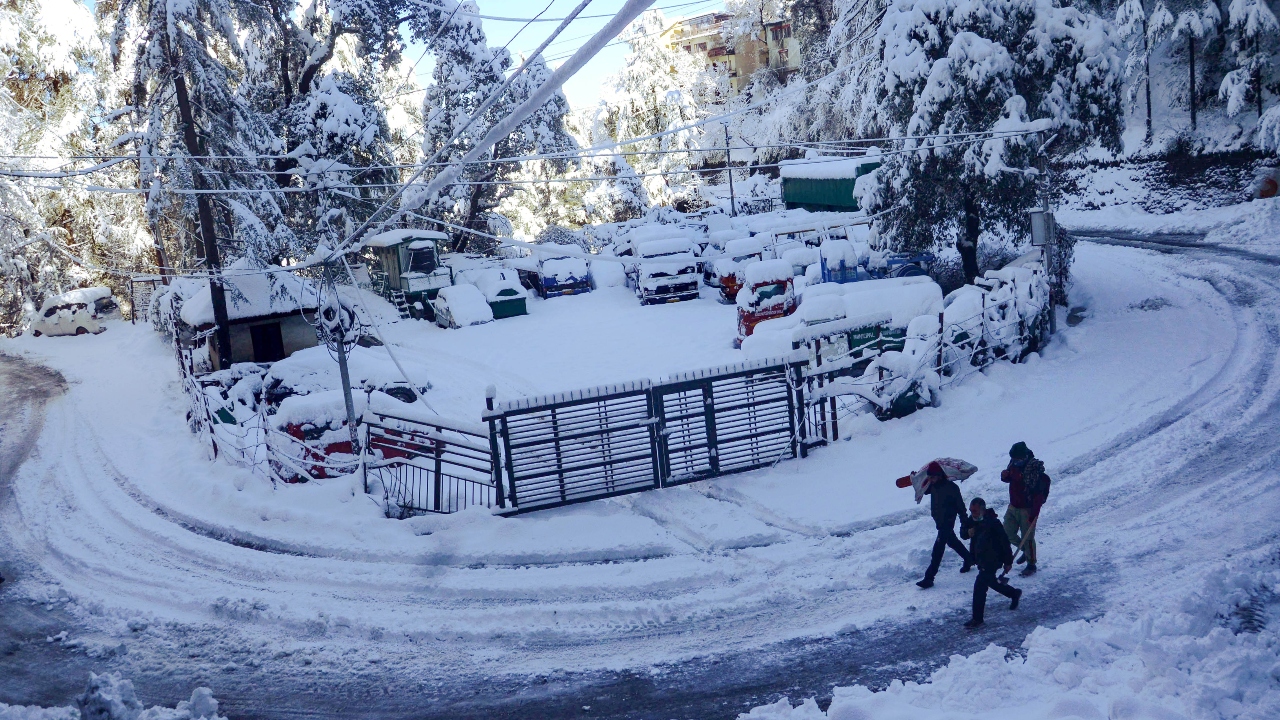 Normal life in the tribal districts of Lahaul-Spiti, Kinnaur and Pangi, and Bharmour of Chamba district was thrown out of gear due to snowfall. Credit: PTI Photo