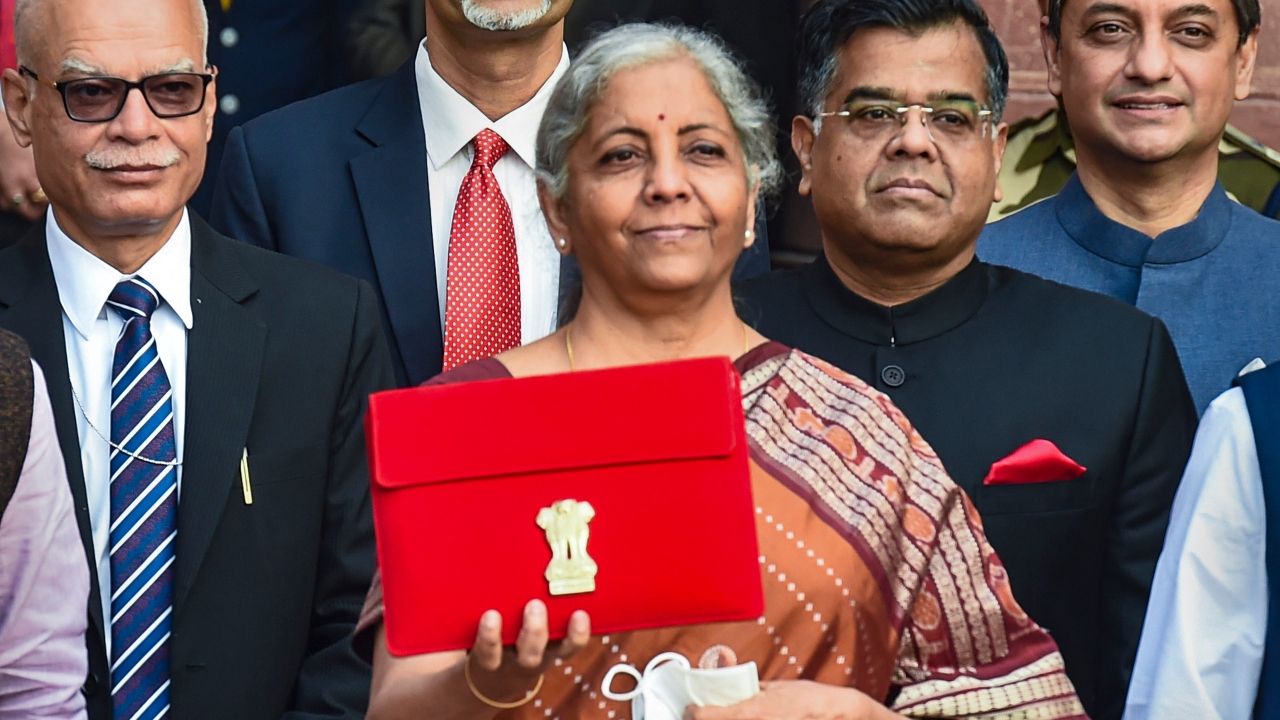 Nirmala Sitharaman holds a tablet containing the Union Budget 2022-23 as she poses for a photograph. Credit: PTI Photo