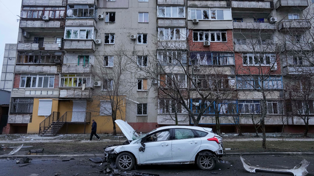 A view of a damaged car in the aftermath of Russian shelling, parked in a street in Mariupol, Ukraine. Credit: AP Photo