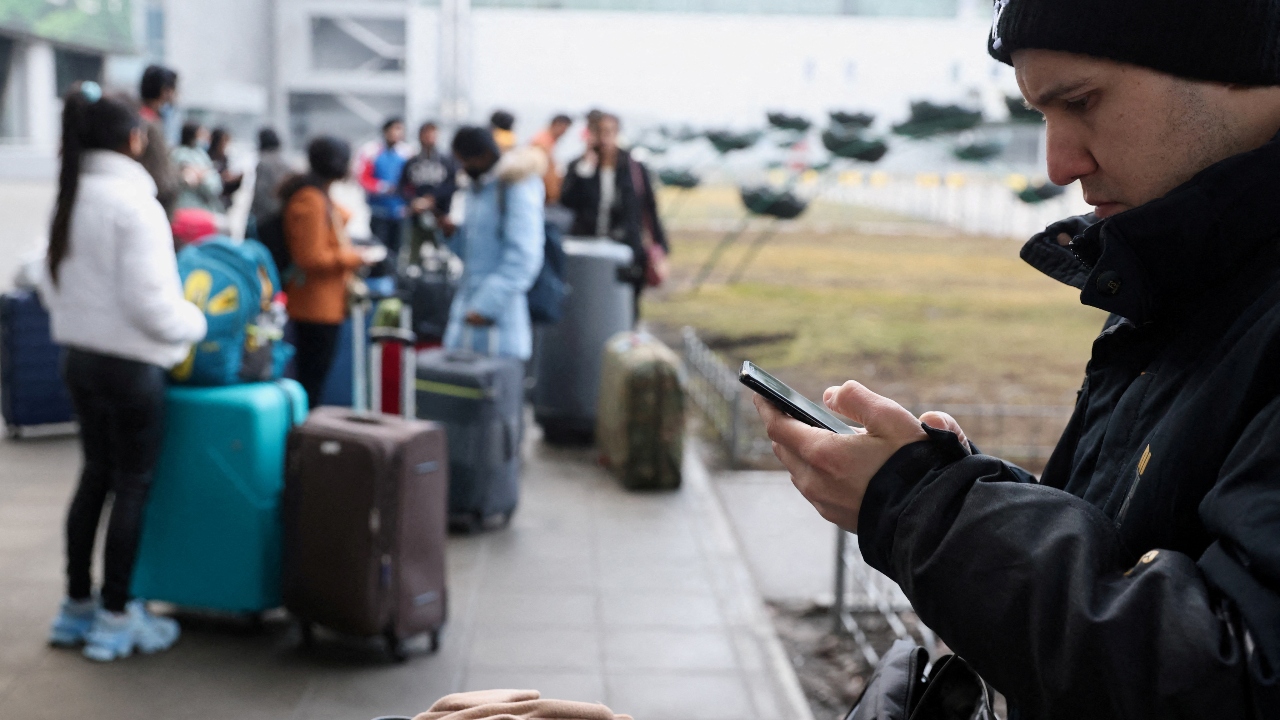People wait at Boryspil International Airport after Russia launched a massive military operation against Ukraine, in Boryspil, Ukraine. Credit: Reuters Photo