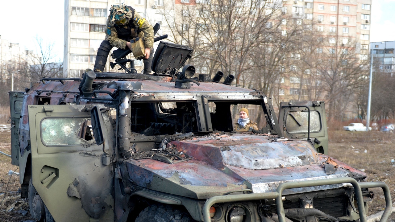 The Ukrainian military is maintaining control at some places around the country amid the intense fighting with the Russian military. In this photo, An Ukrainian Territorial Defence fighter is seen examining a destroyed Russian infantry mobility vehicle in Kharkiv. Credit: AFP Photo