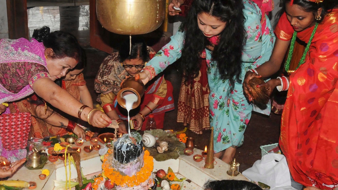Devotees perform 'abhishek' on Lord Shiva at a temple on the occasion of Maha Shivratri, in Ranchi. Credit: PTI Photo