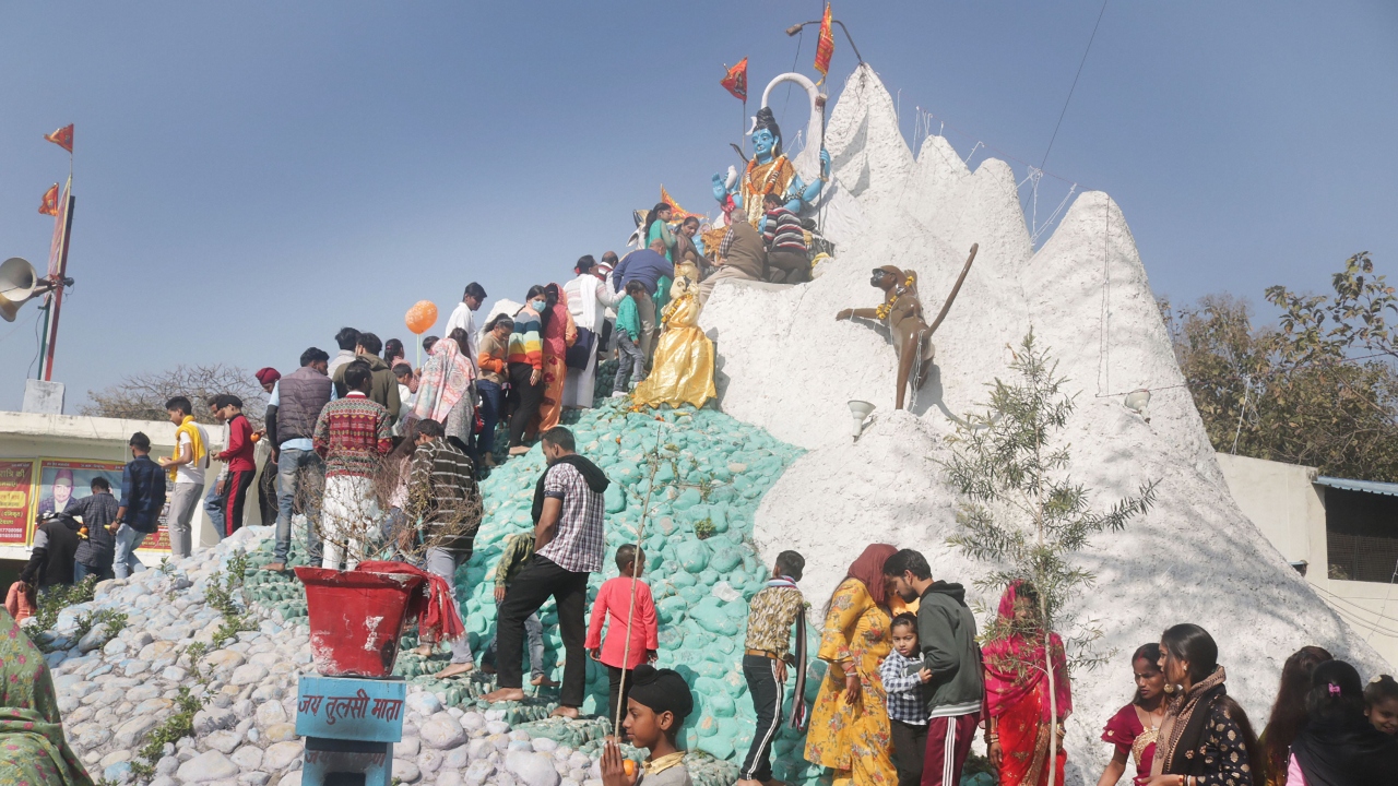Devotees wait in a long queue as they wait to offer prayers to Lord Shiva on the occasion of Maha Shivratri at a Shiva temple in Patiala. Credit: PTI Photo