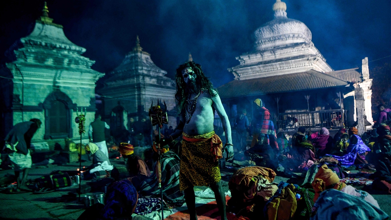A sadhu stands near the lord Shiva temple at the Pashupatinath temple in Kathmandu. Credit: AFP Photo