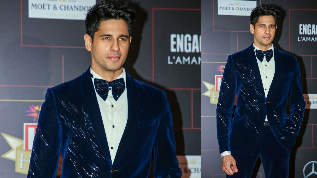 Sidharth Malhotra looked dapper in a blue velvet suit. Credit: PTI Photo