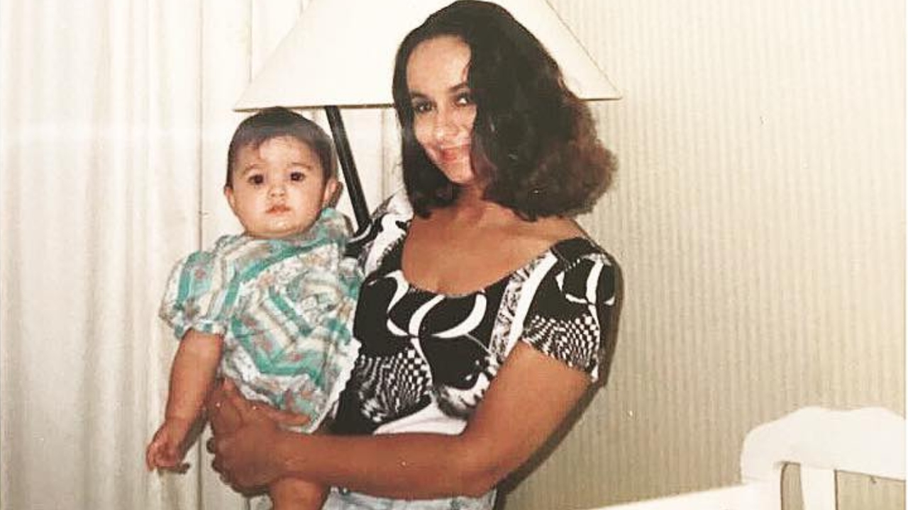 A picture of Alia in her mother's arms.  Credit: Instagram/aliaabhatt