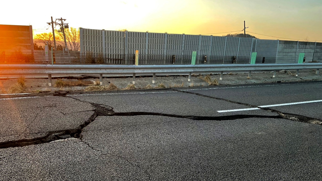 Cracks on a damaged road between Kunimi IC and Shiroishi IC on the Tohoku Expressway (down line) in Shiroishi, Miyagi. Credit: AFP Photo