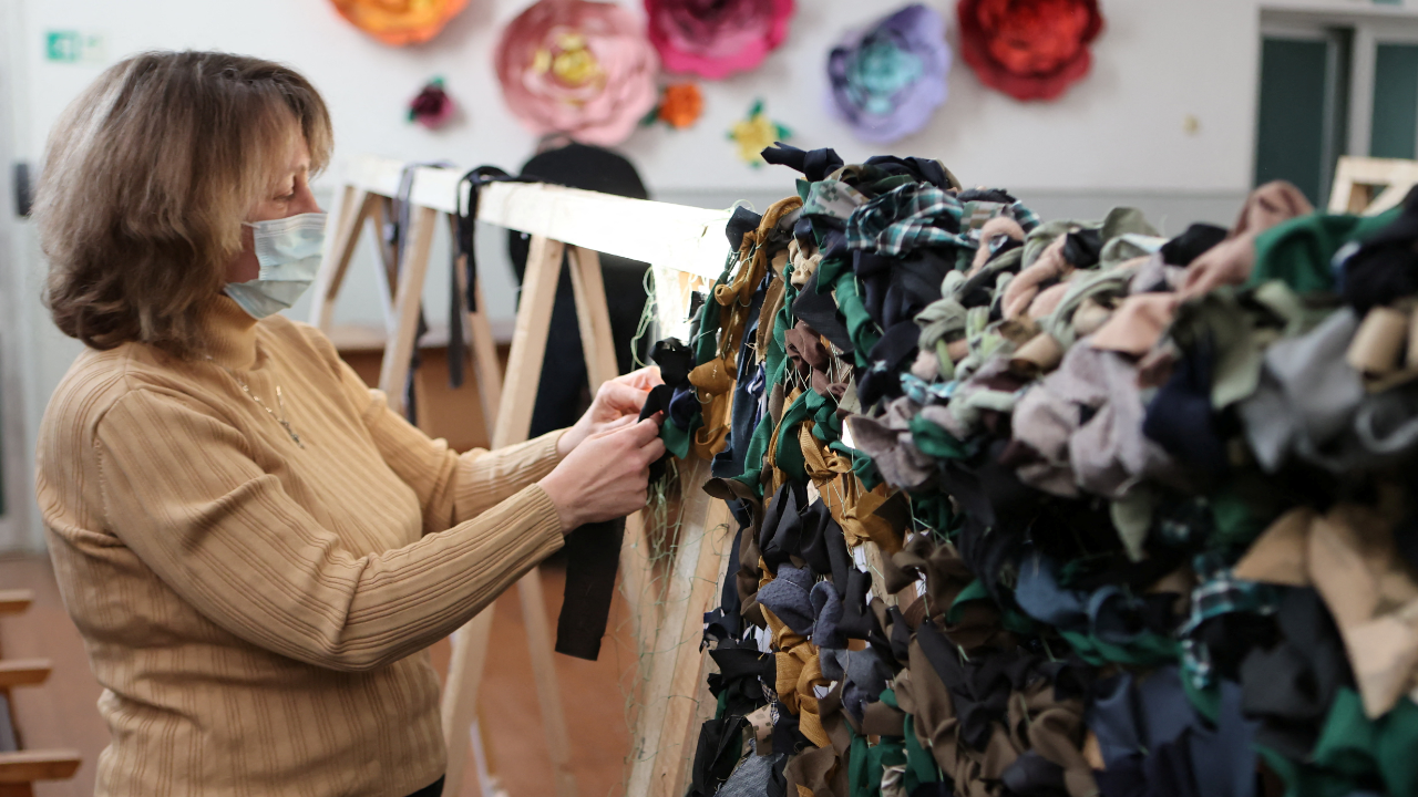A volunteer knits camouflage nets for Ukraine's Armed Forces at a church, as Russia's invasion of Ukraine continues, in Ivano-Frankivsk, Ukraine. Credit: Reuters Photo