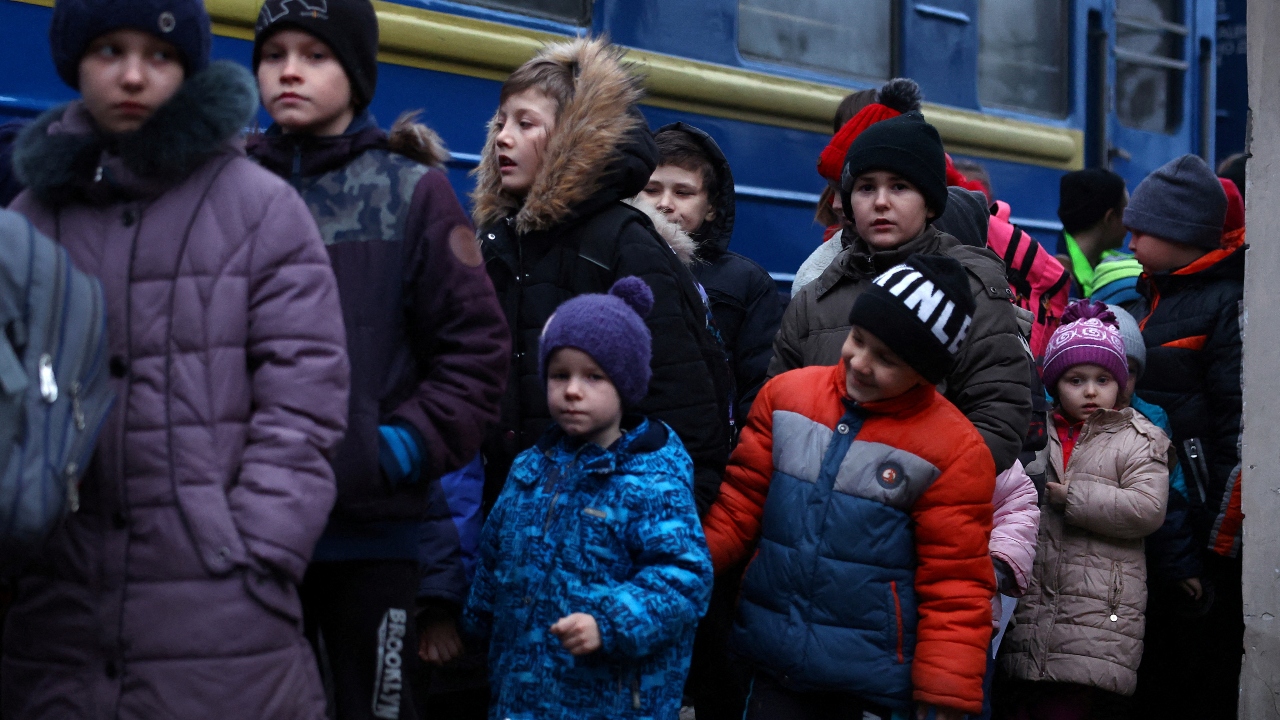 A group of children wait to board a bus for their transfer to Poland after fleeing the ongoing Russian invasion at the main train station in Lviv, Ukraine. More than 4 million people have fled Ukraine, the United Nations said — meaning that nearly 10 per cent of the prewar population has left their country in about five weeks. Credit: Reuters Photo