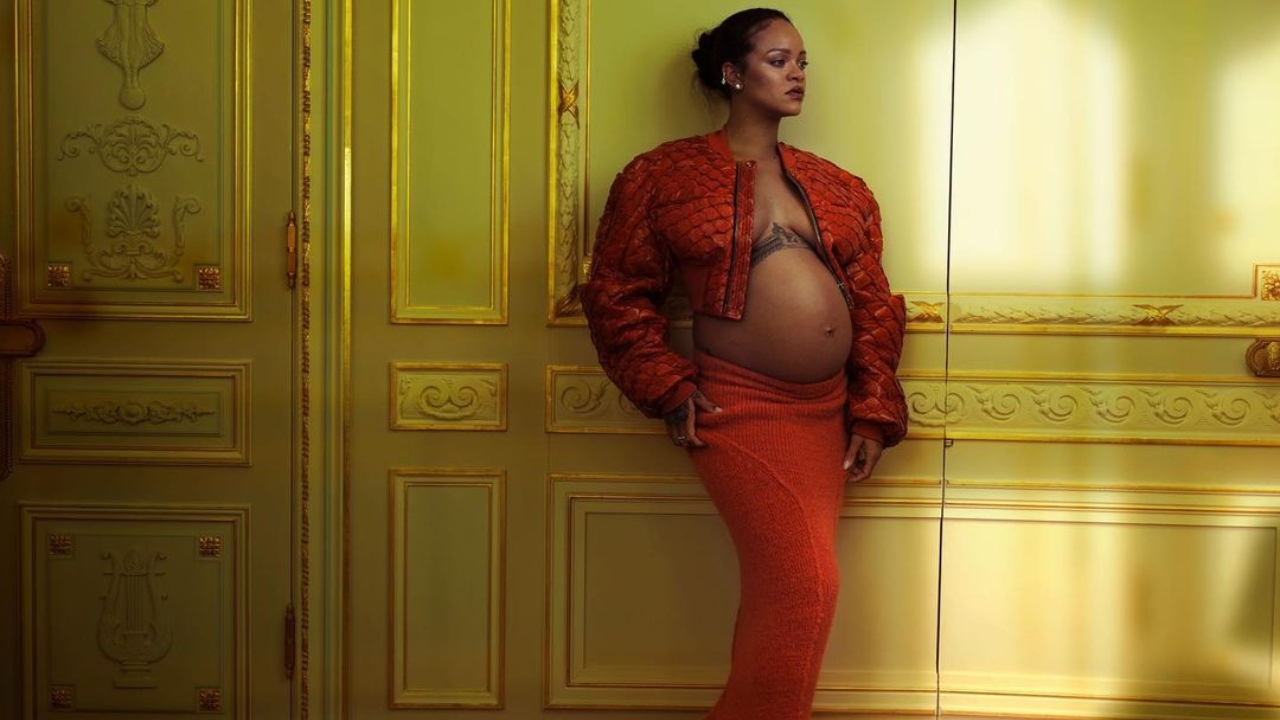 Rihanna looks radiant in a red crop jacket and skirt. Credit: Instagram/badgalriri