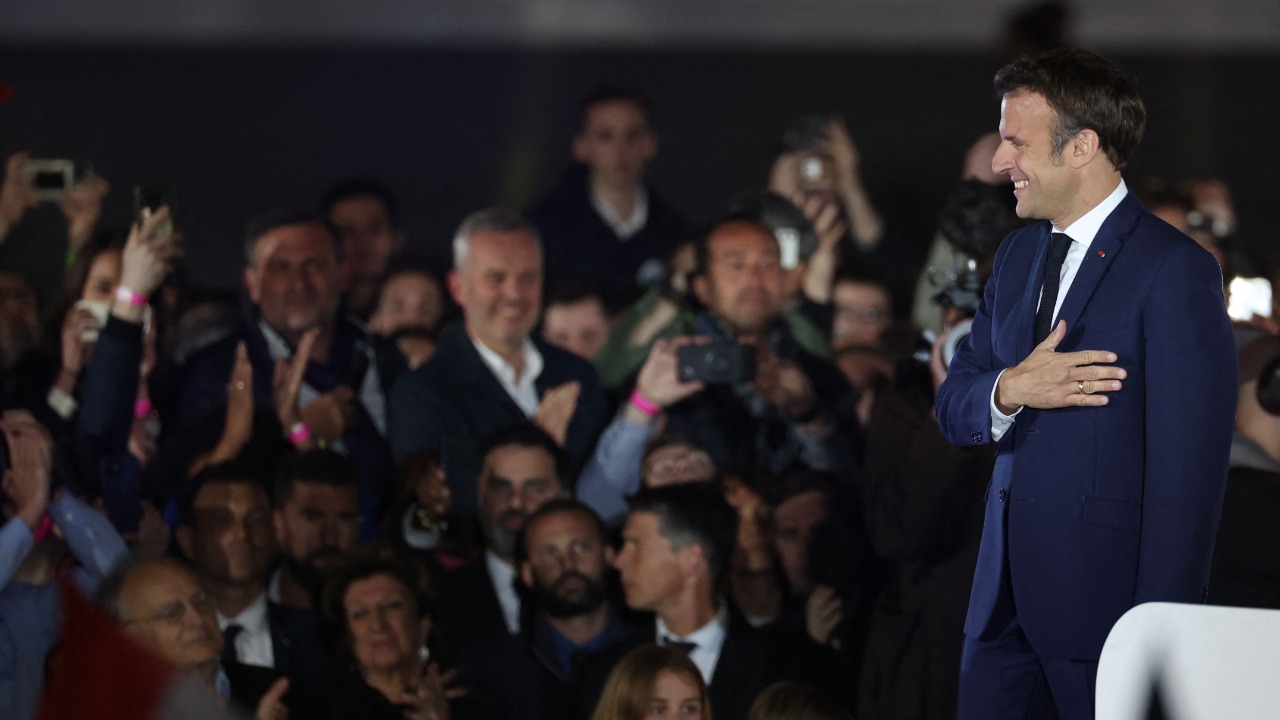 French President and La Republique en Marche (LREM) party candidate for re-election Emmanuel Macron celebrates after his victory in France's presidential election. Credit: AFP Photo
