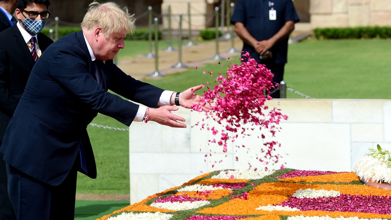On the last day of his two-day trip, the British prime minister kick-started his day by paying his respects to Mahatma Gandhi at Rajghat. Credit: PTI Photo