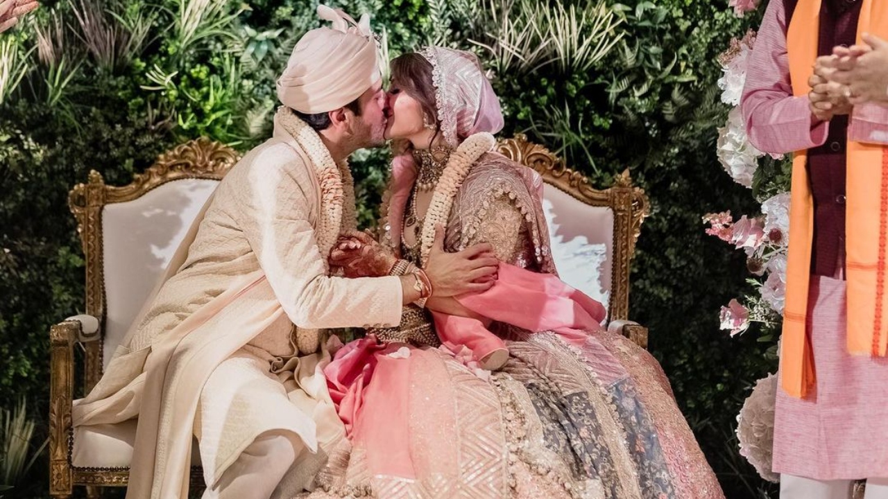 In one of the pictures, the couple was seen sharing a kiss at the wedding. Credit: Instagram/kanik4kapoor