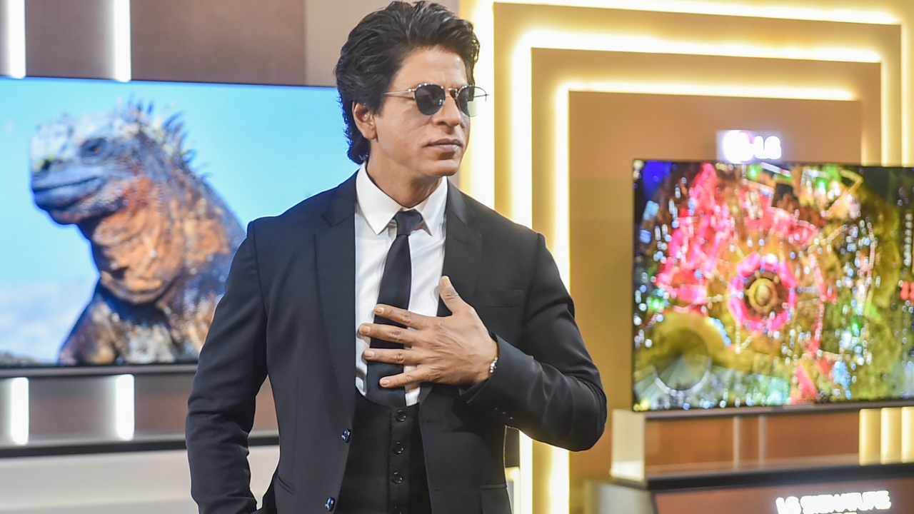 SRK gets clicked on the stage during the launch event of LG's new range of televisions in Delhi. Credit: AFP Photo