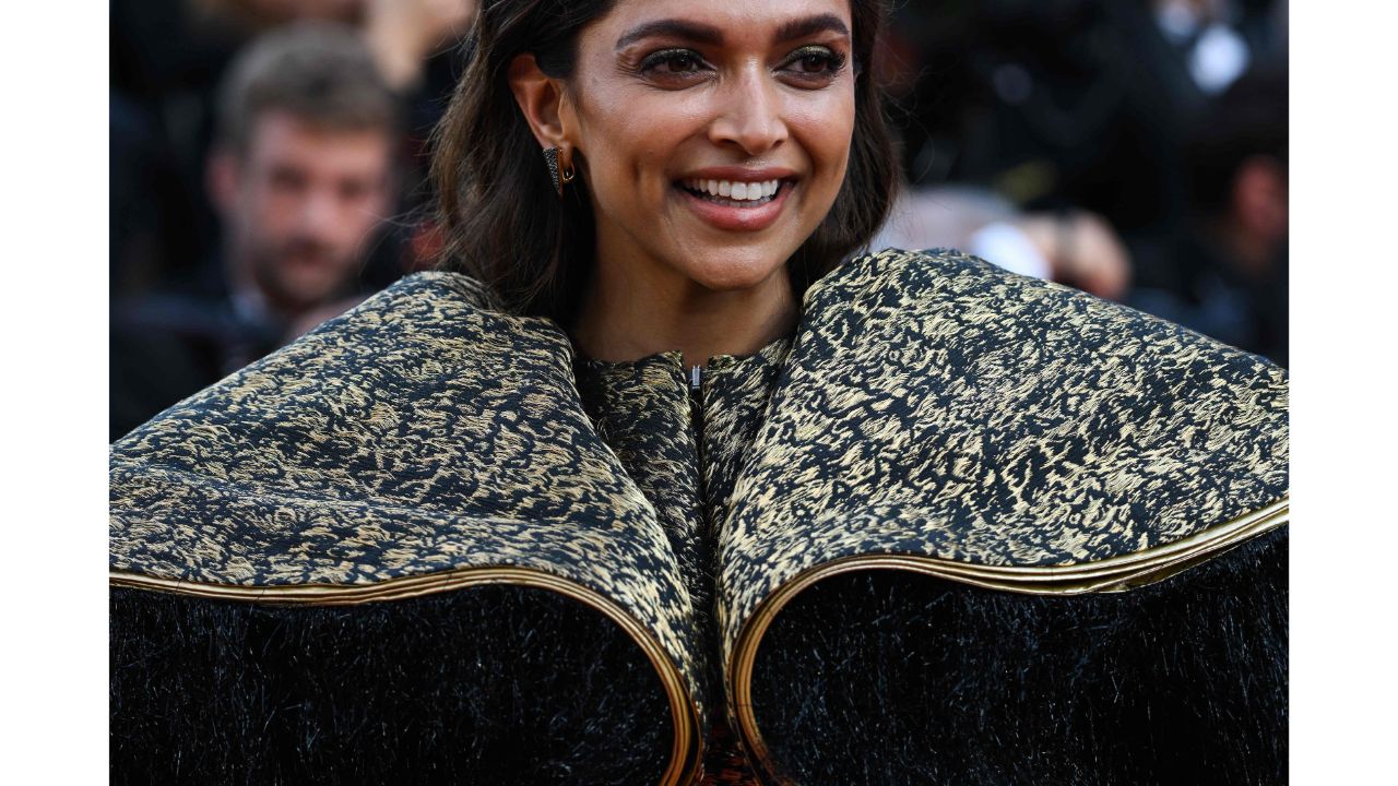 She enhanced her look with black fur sleeves, smokey eyes and a nude-brown lip. Credit: AFP Photo