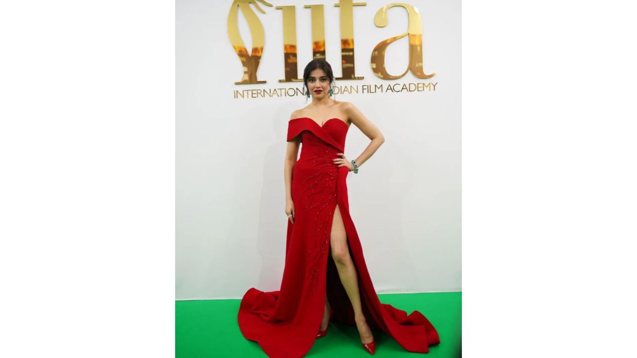 Divya Khosla Kumar cuts a statuesque figure in a red thigh-high slit dress. Credit: IIFA