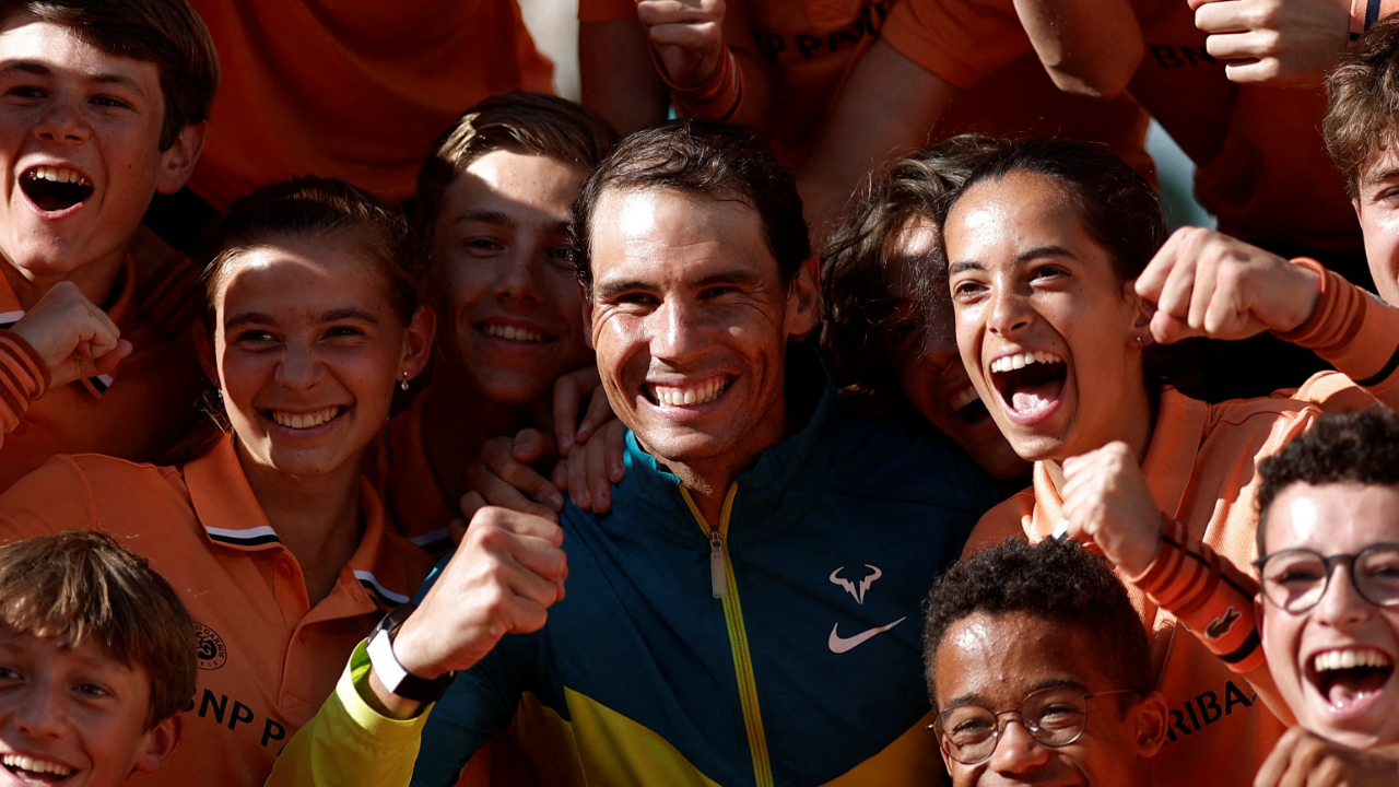 Spain's Rafael Nadal poses with ballboys as he celebrates after victory over Norway's Casper Ruud during their men's singles final match on day fifteen of the Roland-Garros Open tennis tournament at the Court Philippe-Chatrier in Paris. Credit: Reuters Photo