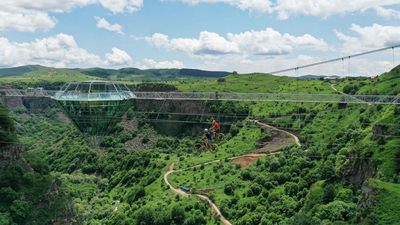 The picturesque cafe is surrounded by waterfalls, panoramic views, a giant swing, as well as cottages and a hotel. Credit: AFP Photo