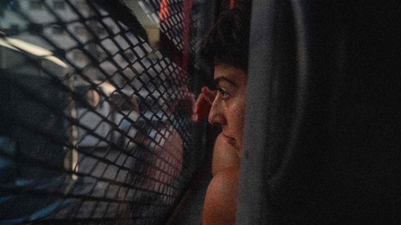 A young woman is seen in a police bus after being detained during a Pride march in Istanbul. Credit: AFP Photo