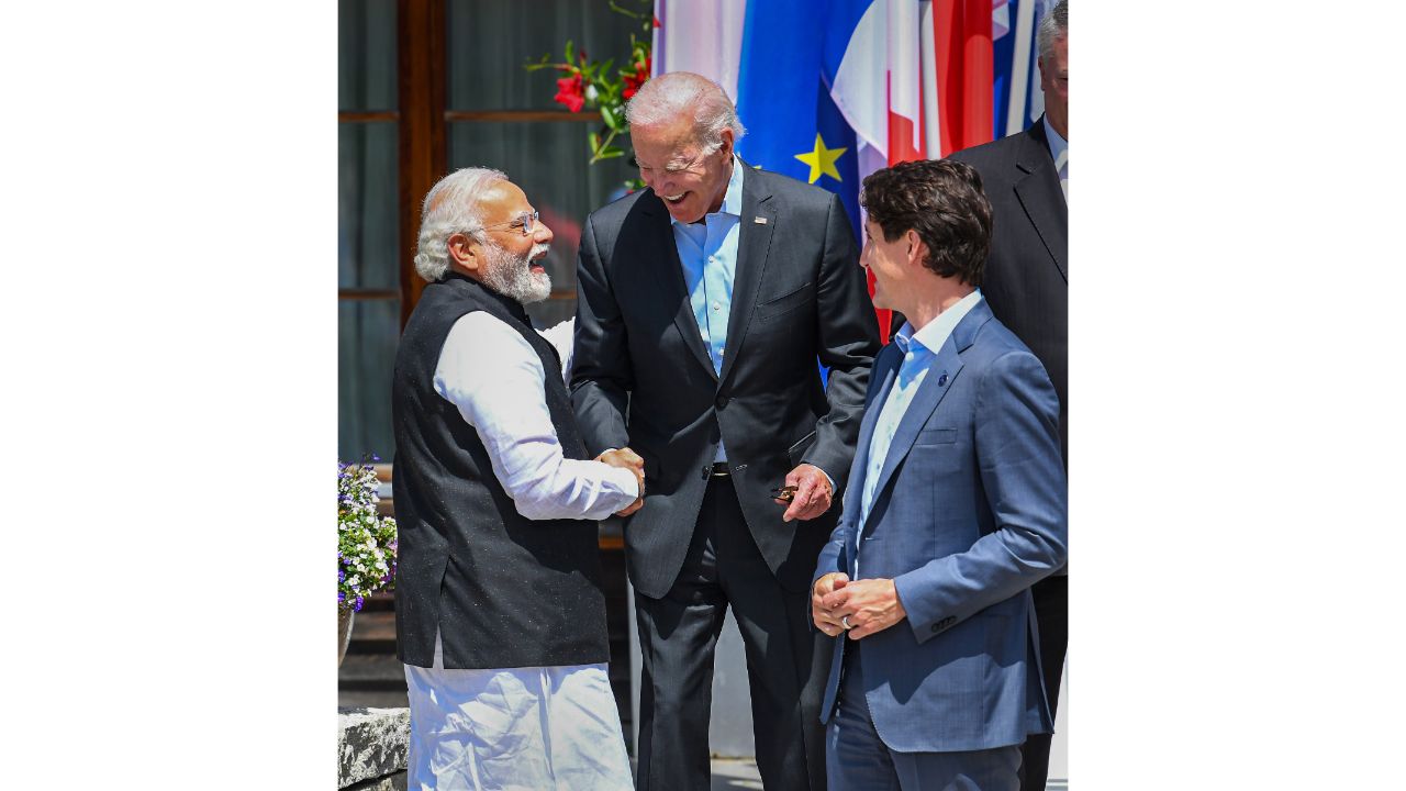 Prime Minister Narendra Modi seen exchanging words with US President Joe Biden and Prime Minister of Canada Justin Trudeau. Credit: PIB Photo