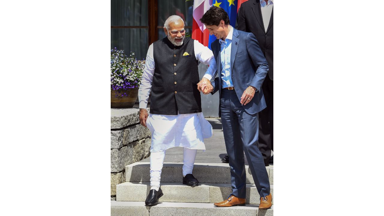 Prime Minister Narendra Modi seen walking hand-in-hand with Canadian PM Justin Trudeau at the G7 Summit in Germany. Credit: Reuters Photo
