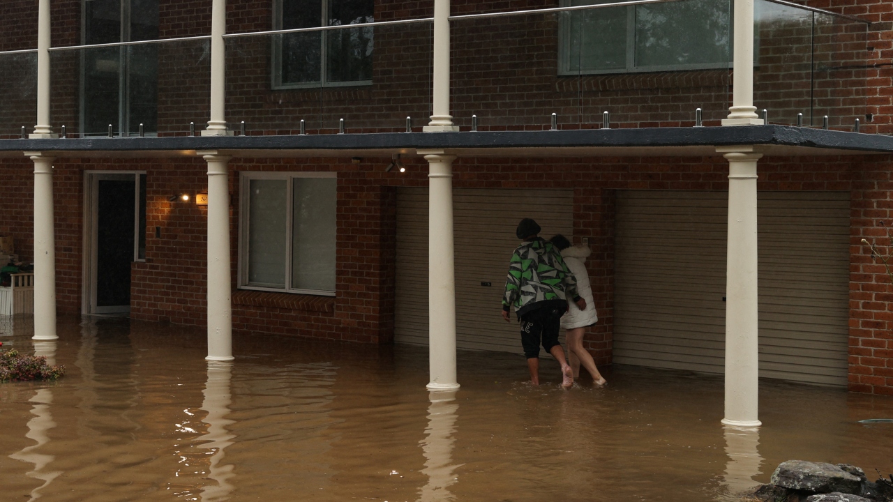Days of torrential rain have caused dams to overflow and waterways to break their banks, bringing a fourth flood emergency in 16 months to parts of the city of five million people. Credit: Reuters Photo