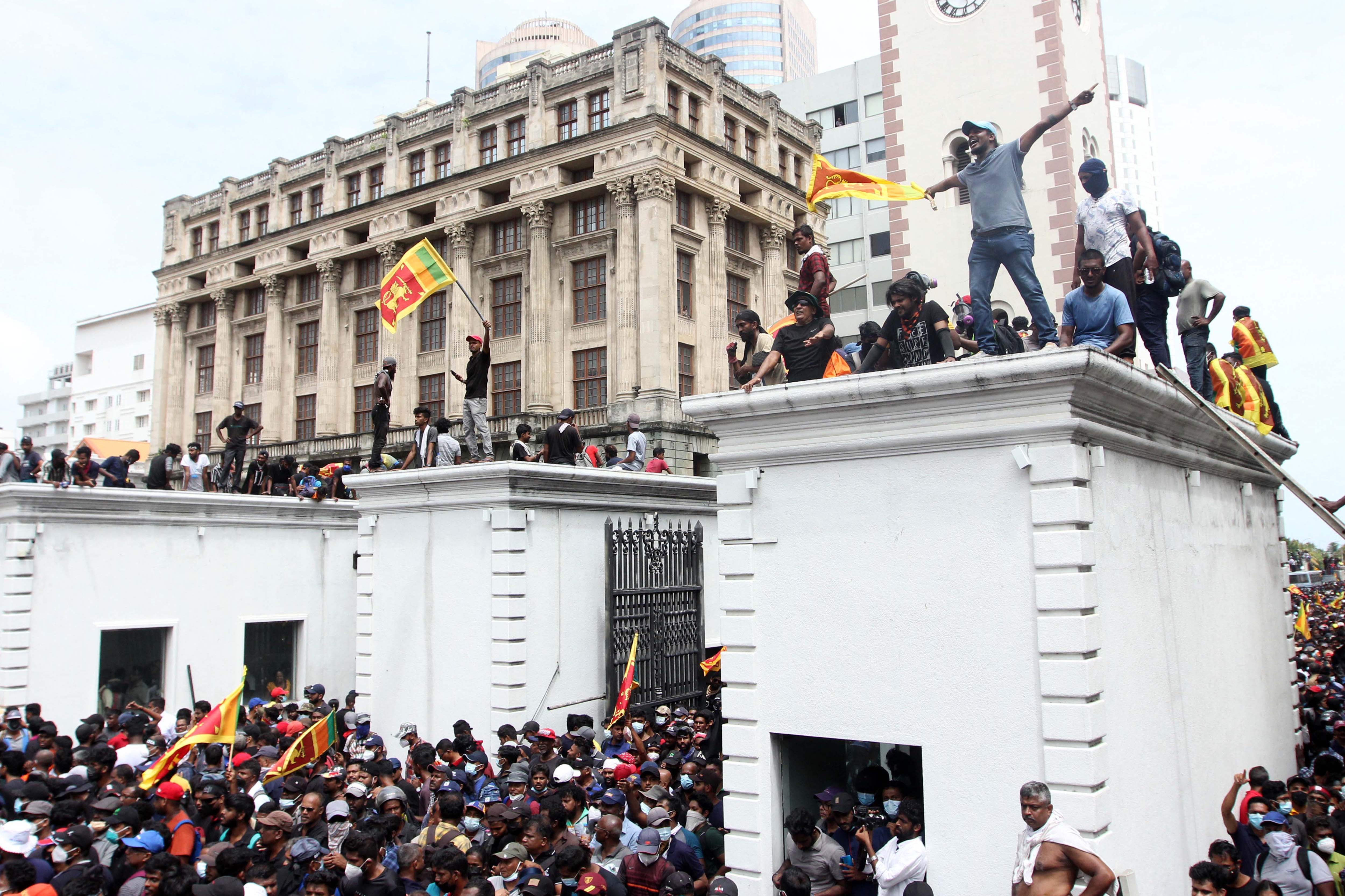 Protestors demanding the resignation of Sri Lanka's President Gotabaya Rajapaksa gather inside the compound of Sri Lanka's Presidential Palace in Colombo. Credit: AFP Photo