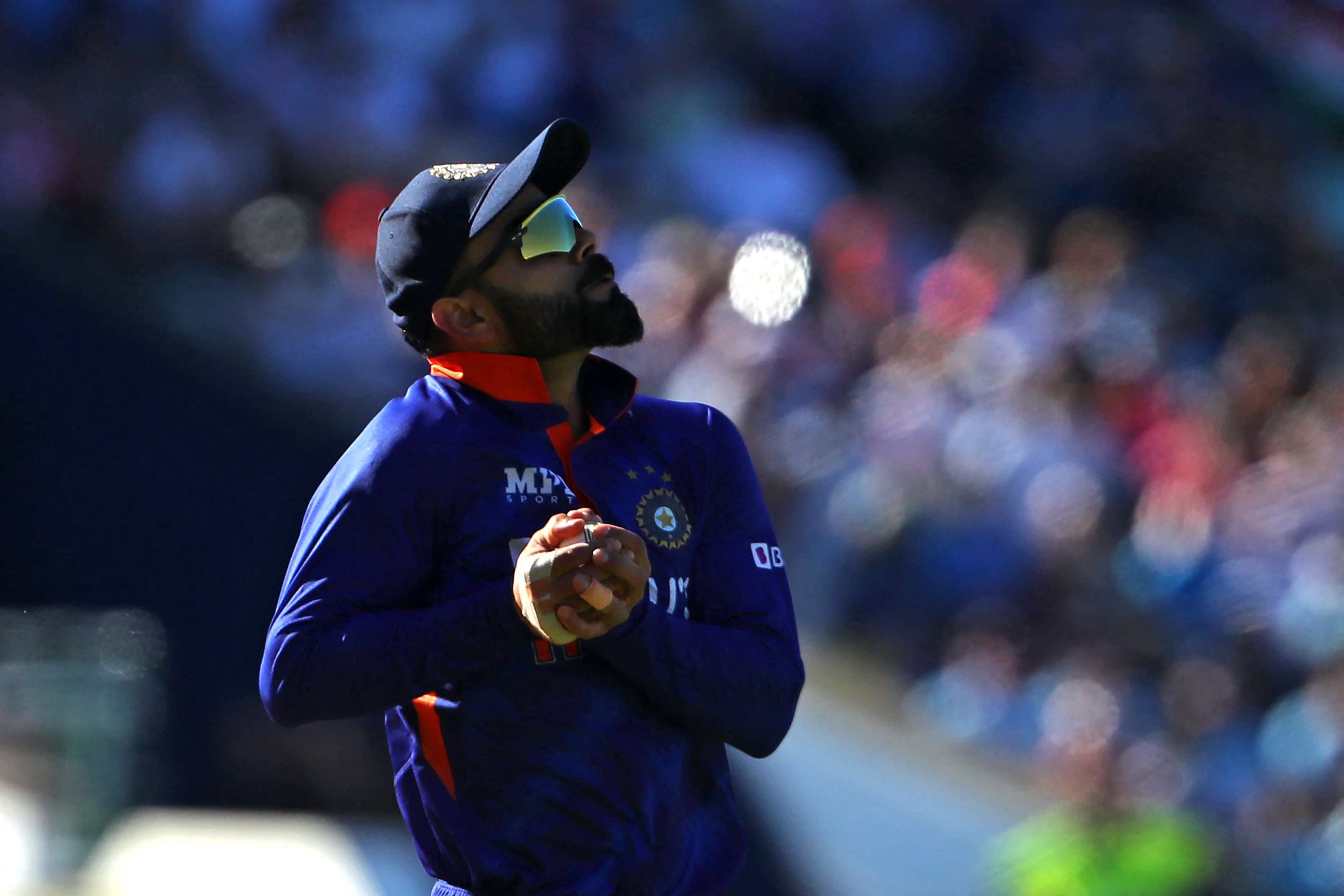 Virat Kohli takes a catch to dismiss England's Richard Gleeson during the '2nd Vitality IT20' Twenty20 International cricket match between England and India at Edgbaston in Birmingham. Credit: AFP Photo