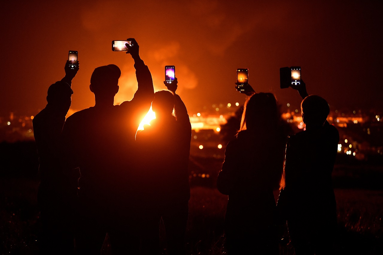 Craigyhill bonfire measuring 202 ft is set alight on the Eleventh night celebrations, in Larne, Northern Ireland. Credit: Reuters Photo