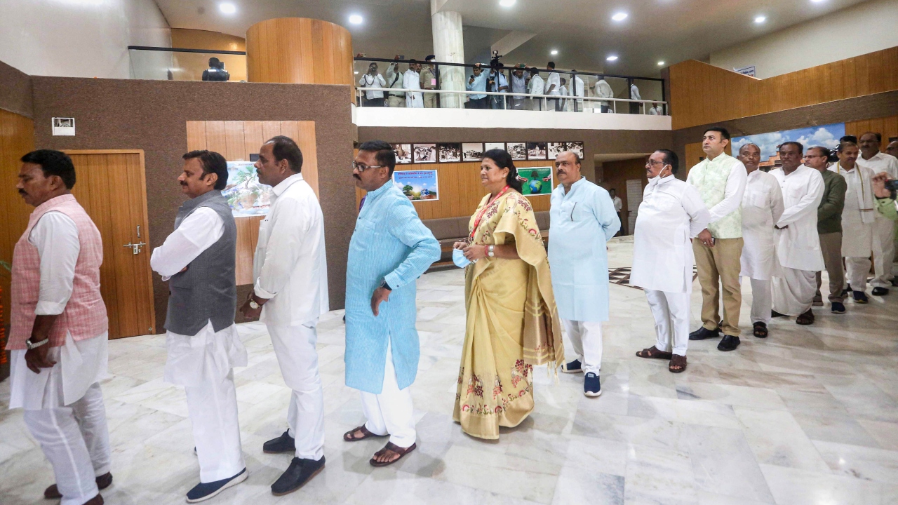 Madhya Pradesh MLAs wait in a queue to cast their vote for the election of the President, in Bhopal. Credit: PTI Photo