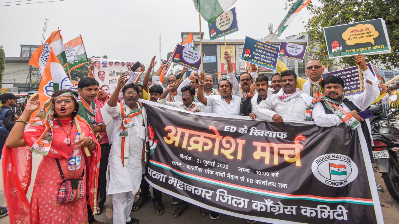 Congress supporters take part in 'Akrosh March' in protest against summoning of party President Sonia Gandhi by the Enforcement Directorate (ED) in the National Herald money laundering case, in Patna. Credit: PTI Photo