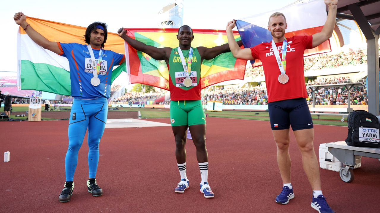 Silver medalist Neeraj Chopra of Team India, gold medalist Anderson Peters of Team Grenada, and bronze medalist Jakub Vadlejch of Team Czech Republic pose after competing in the Men's Javelin Final. Credit: AFP Photo