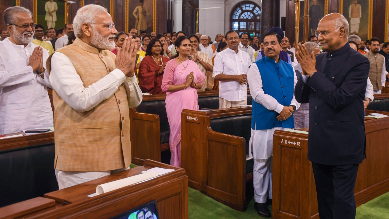 President Ram Nath Kovind and Prime Minister Narendra Modi exchange greetings during the latter's farewell function at Parliament House in New Delhi. Credit: PTI Photo