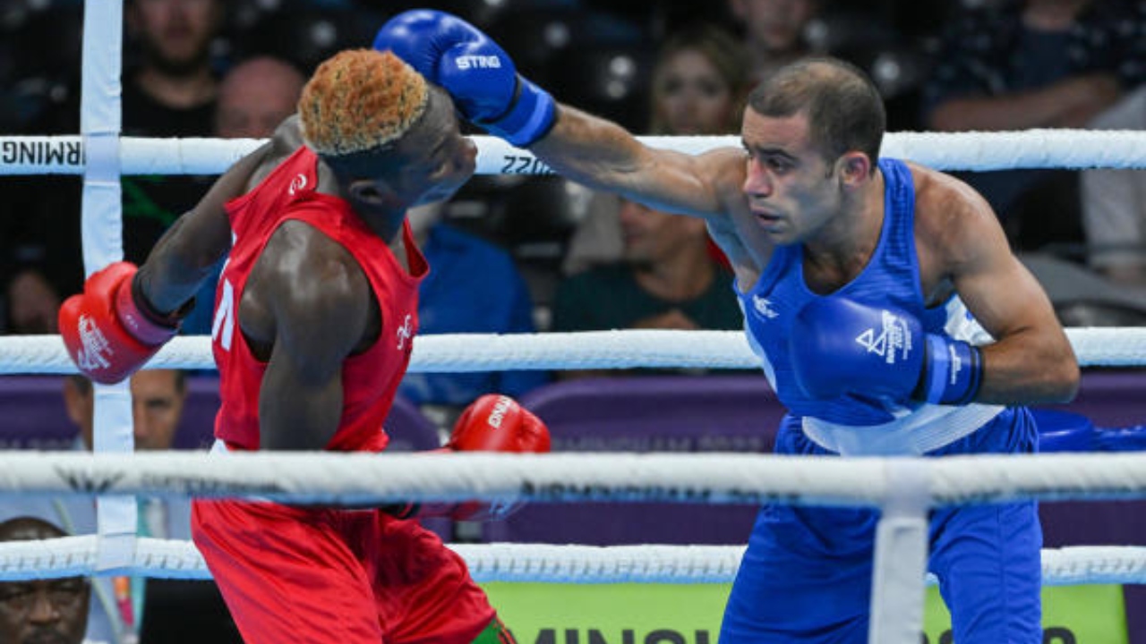 India's Amit Panghal (blue) lands a punch on Zambia's Patrick Chinyemba in the semi-final match of the men’s over 48kg-51kg (Flyweight) boxing event, at the Commonwealth Games 2022 (CWG), in Birmingham, UK, Saturday, Aug. 6, 2022. Credit: PTI Photo
