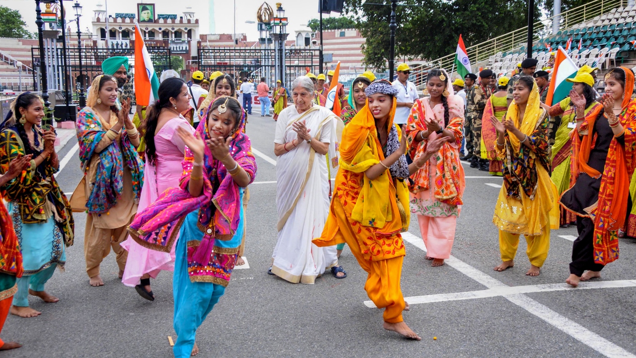 Artists perform during a ceremony to mark the 'Raksha Bandhan' festival, at the India-Pakistan Wagah Border Post, in Amritsar. Credit: PTI Photo