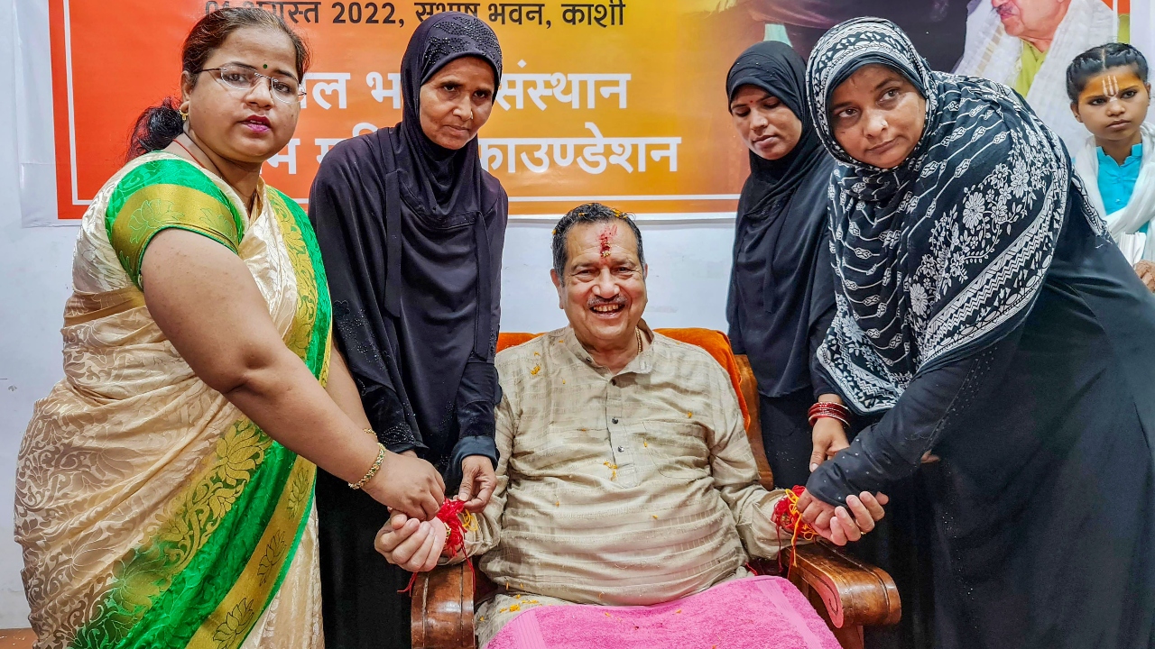Muslim women tied a rakhi on the wrist of RSS leader Indresh Kumar, ahead of the festival, in Varanasi. Credit: PTI Photo