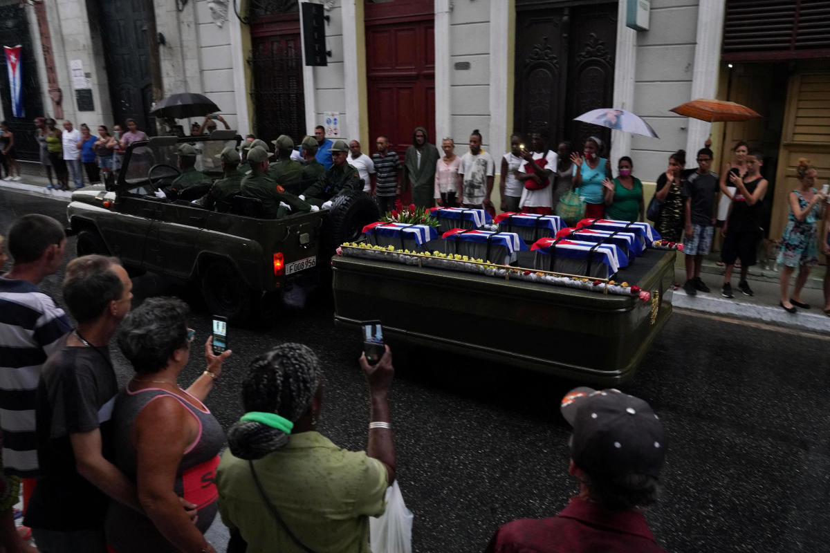 Honor guards pass by on their way to the cemetery carrying the remains of firefighters who died fighting a fire at fuel storage tanks, in Matanzas, Cuba. Credit: Reuters Photo