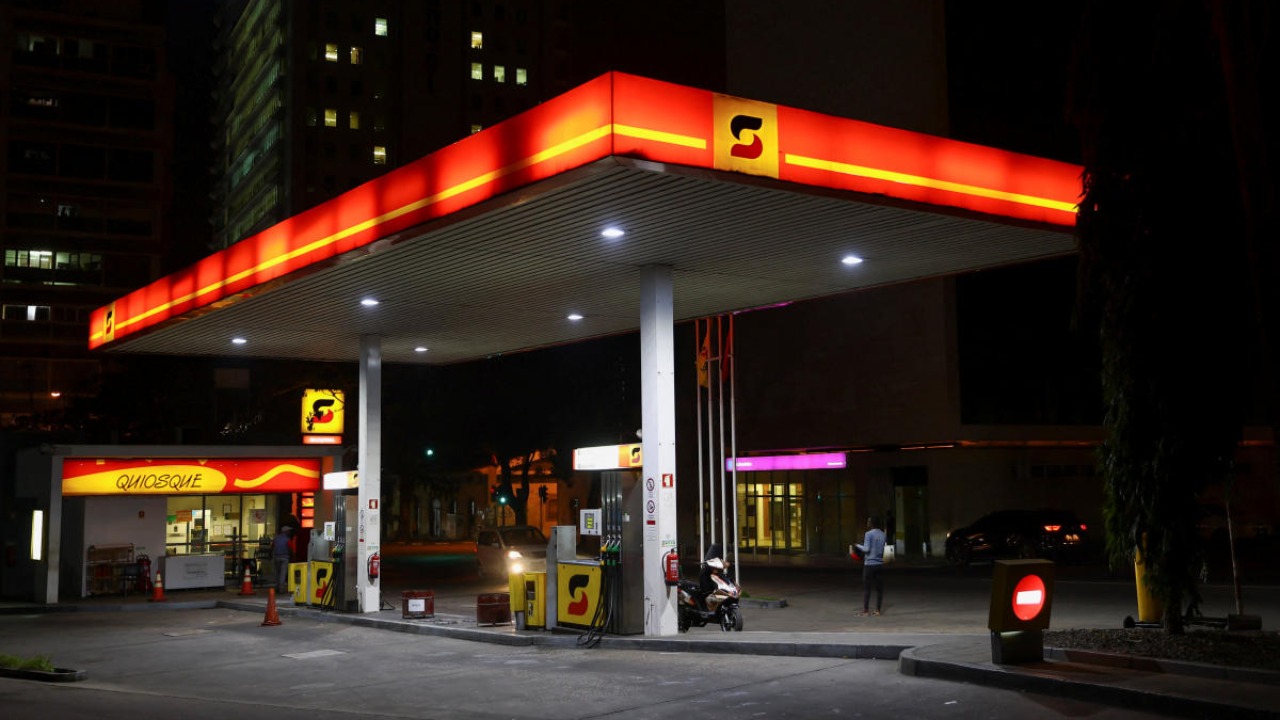 A motorbike is parked at a Sonangol fuel station in Luanda, Angola. Credit: Reuters photo