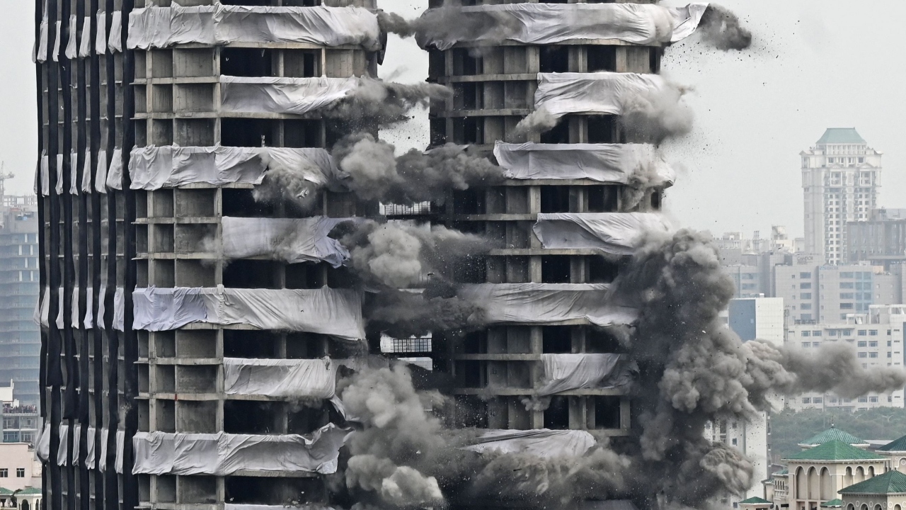 The twin buildings, which comprise 915 flats and are located just nine metres from Emerald Court's Aster-2 apartment block, were fully rigged with explosives and wired up. Credit: AFP Photo