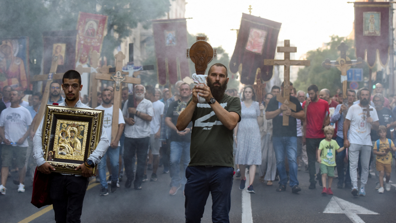 A man wearing a T-shirt with letter Z, holds an icon during a protest against the international LGBT event Euro Pride in Belgrade, Serbia, August 28, 2022. Credit: Reuters Photo